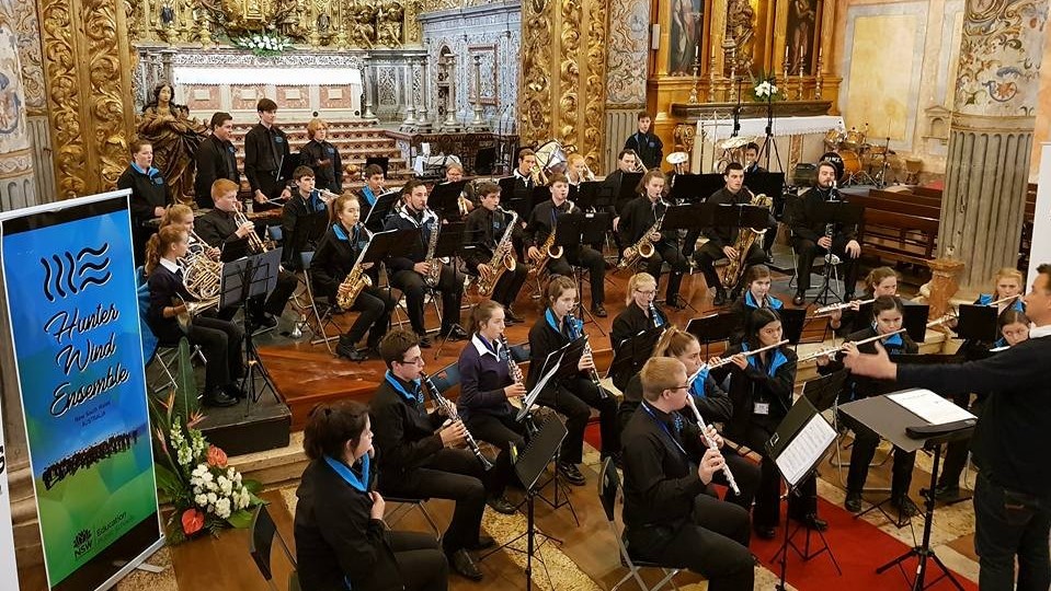 The Hunter Wind Ensemble performing in a church
