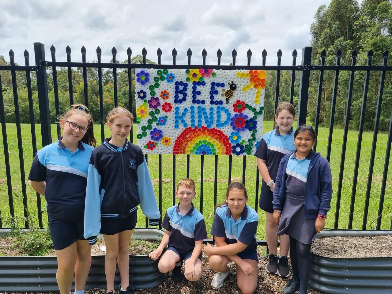 Students of Wallsend South Public School with their artwork Bee Kind