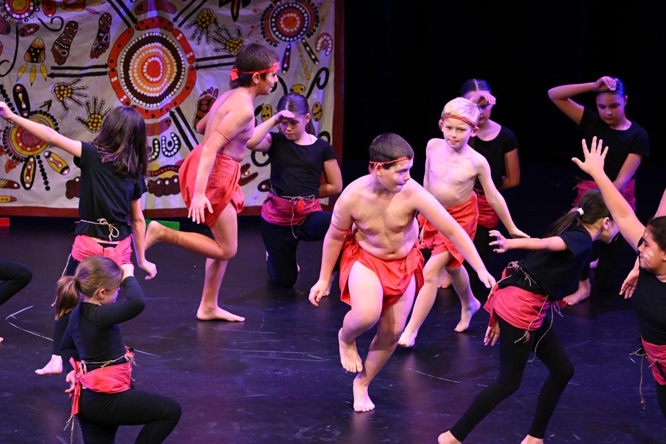 Indigenous students dancing on stage 