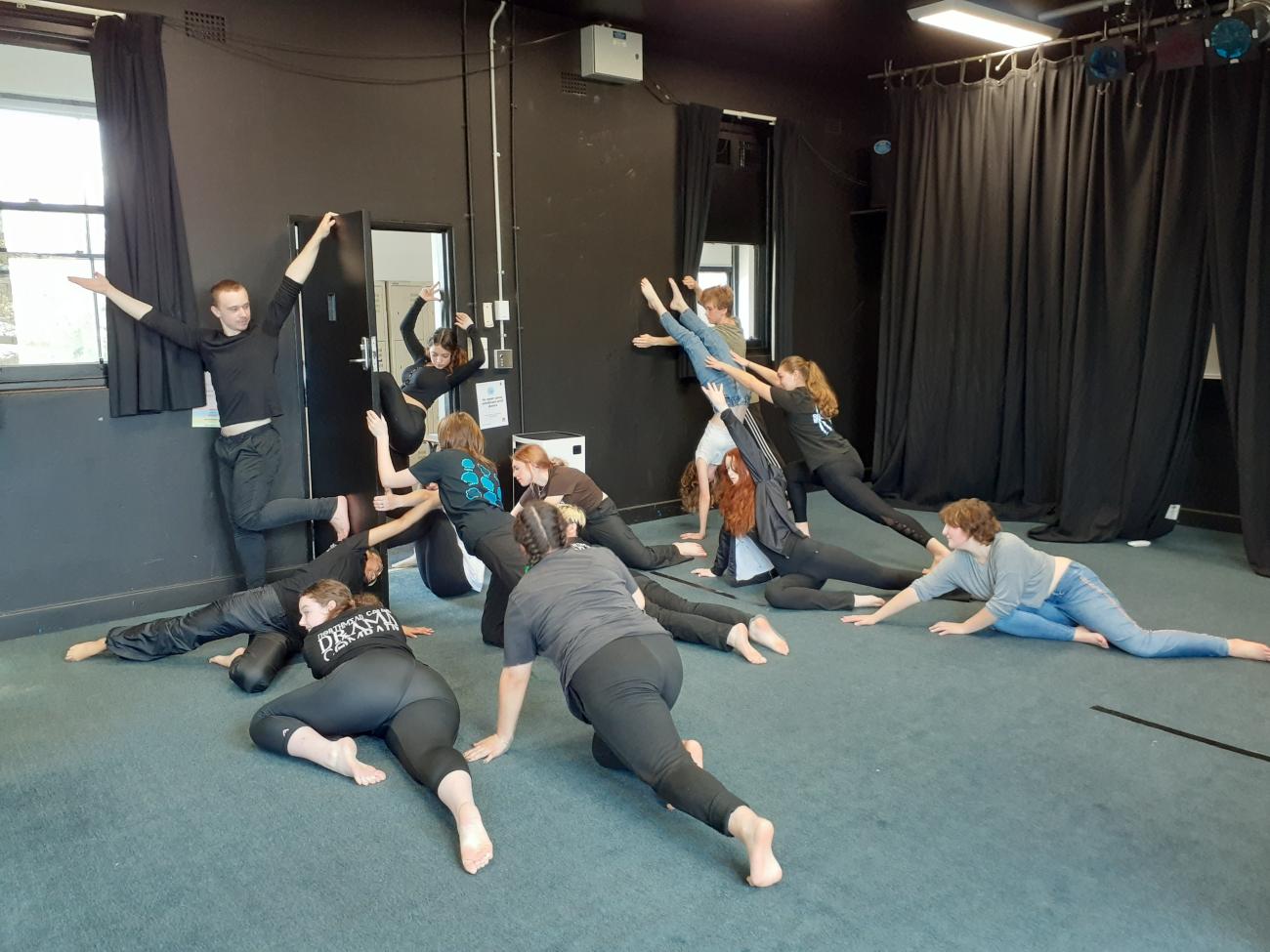 Drama students in a group formation at workshop